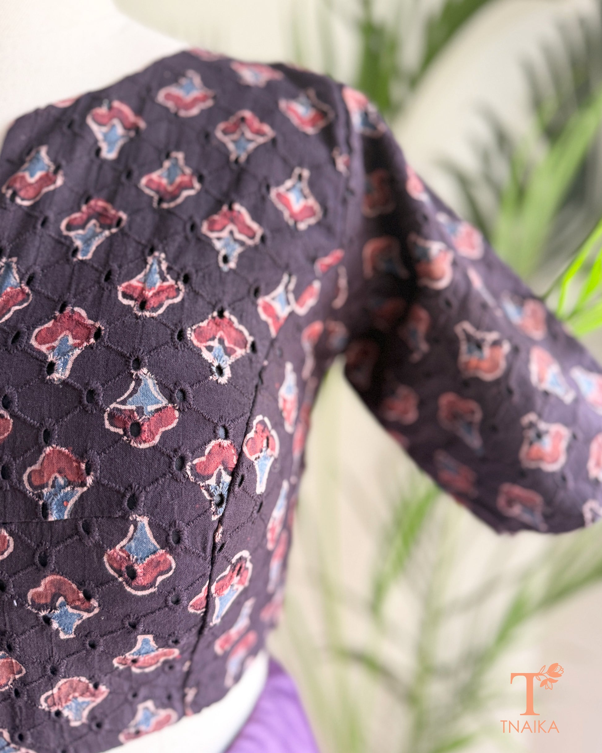 Ajrakh hand block print Hakoba cotton readymade blouse with embroidered eyelet fabric and V-notch neckline.