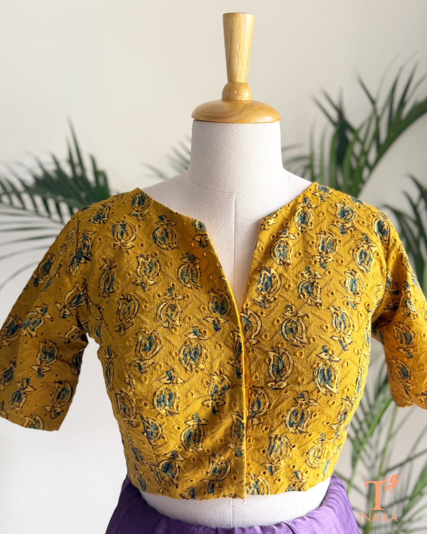 Ajrakh hand block print Hakoba cotton readymade blouse with embroidered eyelet fabric and V-notch neckline.