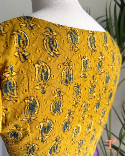 Hakoba cotton blouse with Ajrakh hand block print, eyelet embroidery and V-notch neckline.
