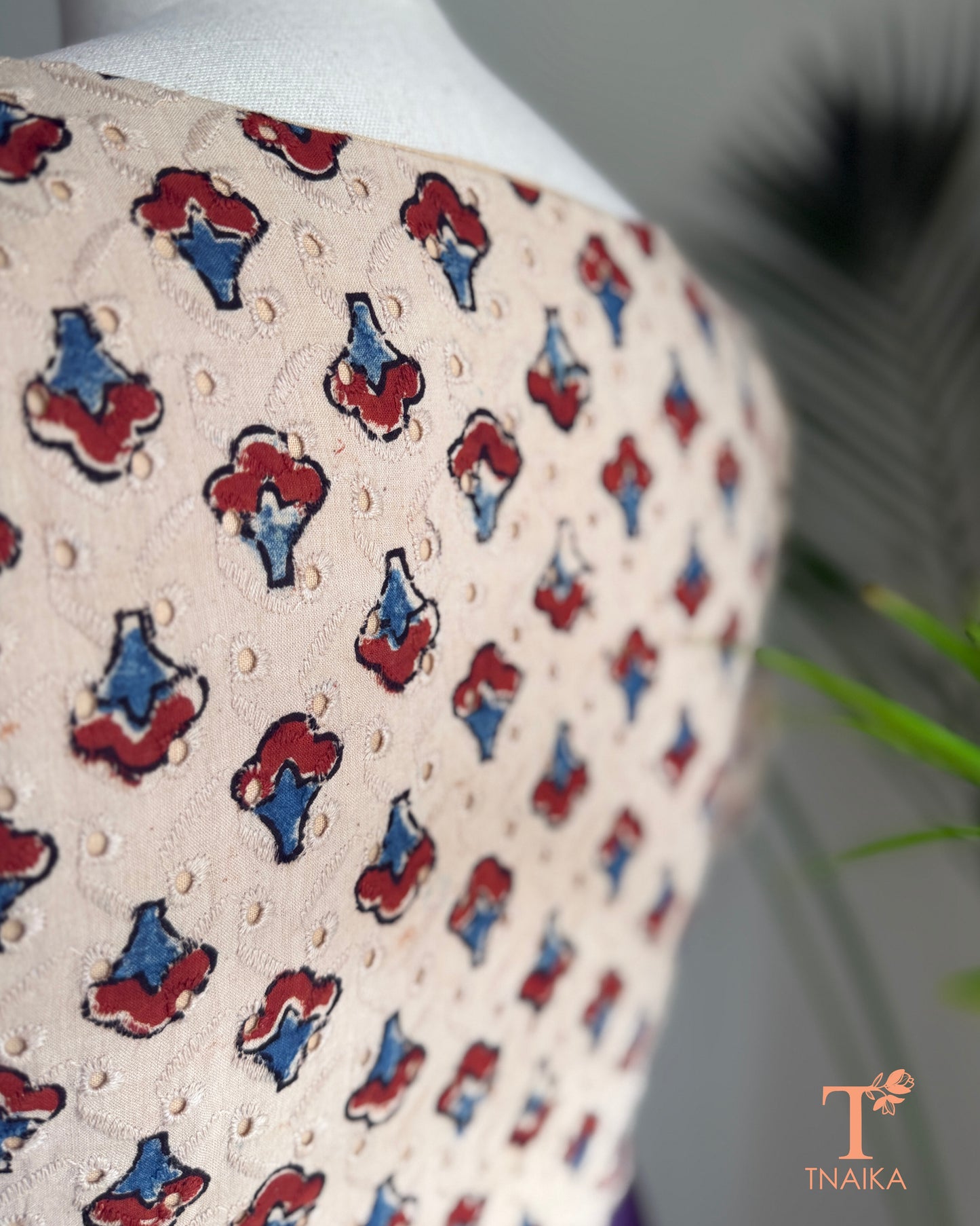 Close-up of embroidered Hakoba fabric showcasing authentic Ajrakh hand block printed motifs.