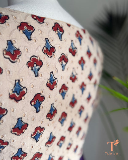 Close-up of embroidered Hakoba fabric showcasing authentic Ajrakh hand block printed motifs.
