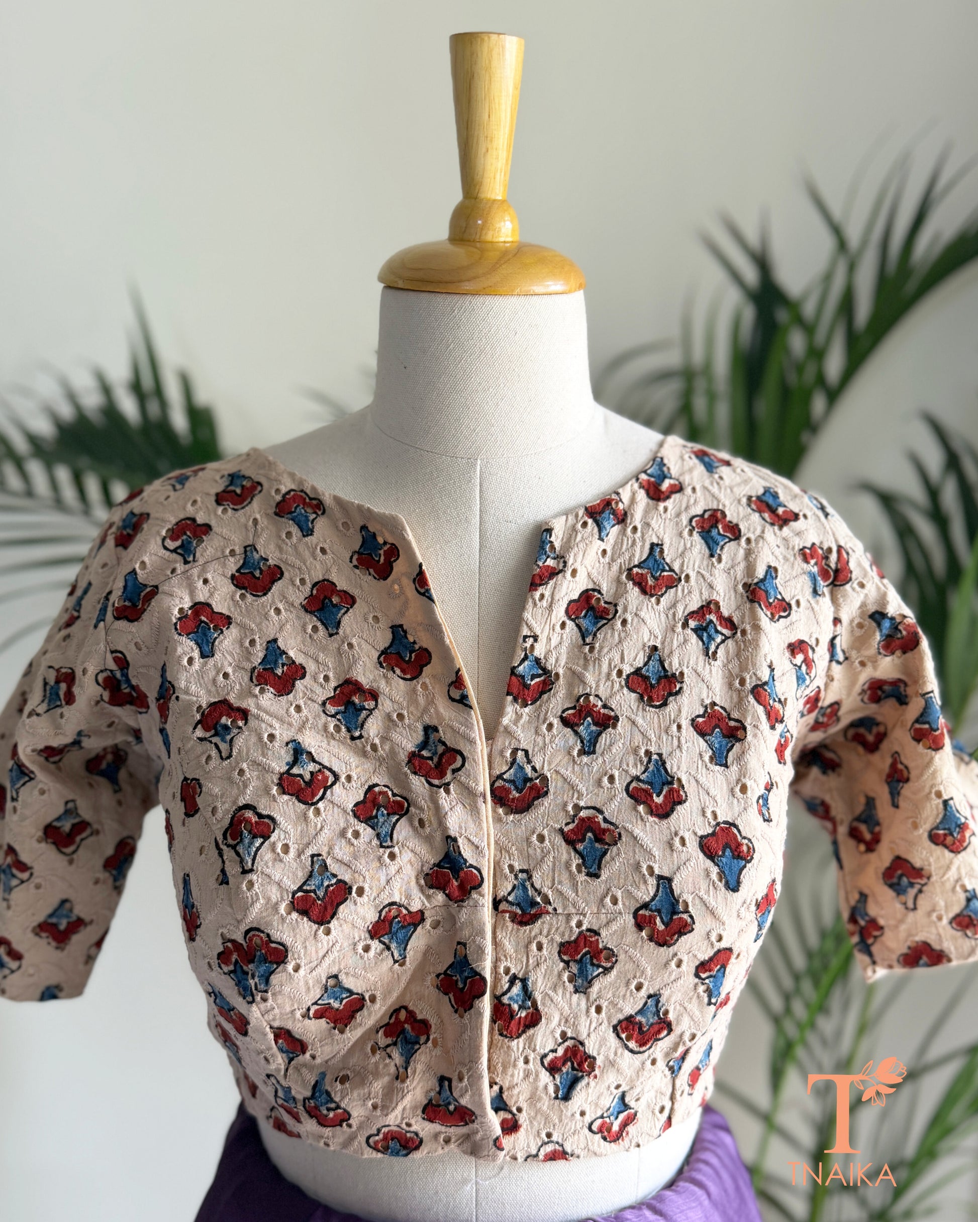 Ajrakh hand block print Hakoba cotton readymade blouse with embroidered eyelet fabric and V-notch neckline.