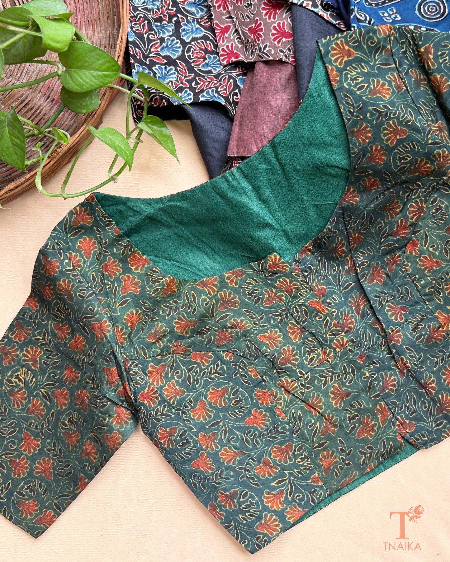 Green modal silk blouse with floral hand block print and half sleeves.
