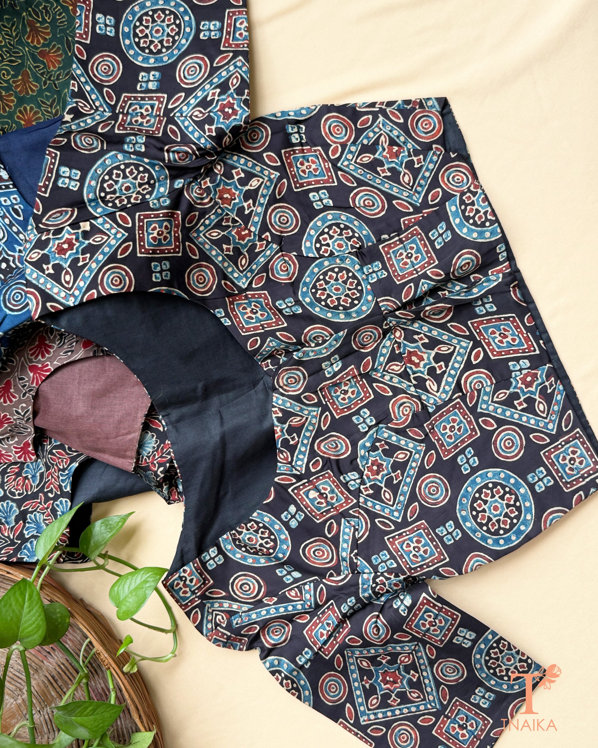 Black modal silk blouse with heritage geometric hand block print and round neckline.