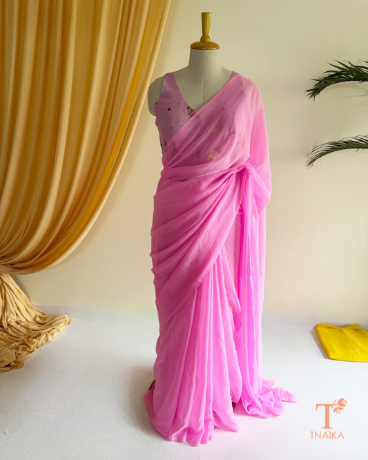 Women's premium georgette saree with soft fluid silhouette.