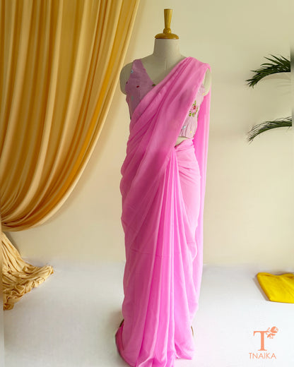 Elegant georgette saree paired with an embroidered blouse.