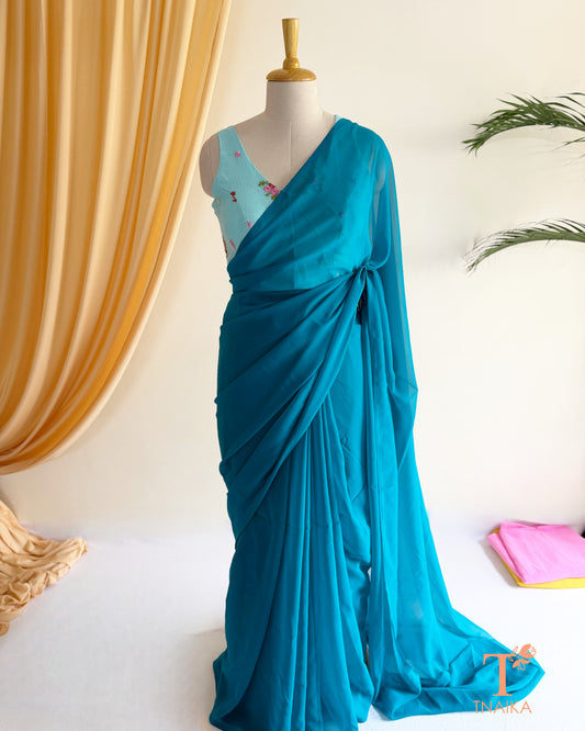 Elegant georgette saree paired with an embroidered blouse.