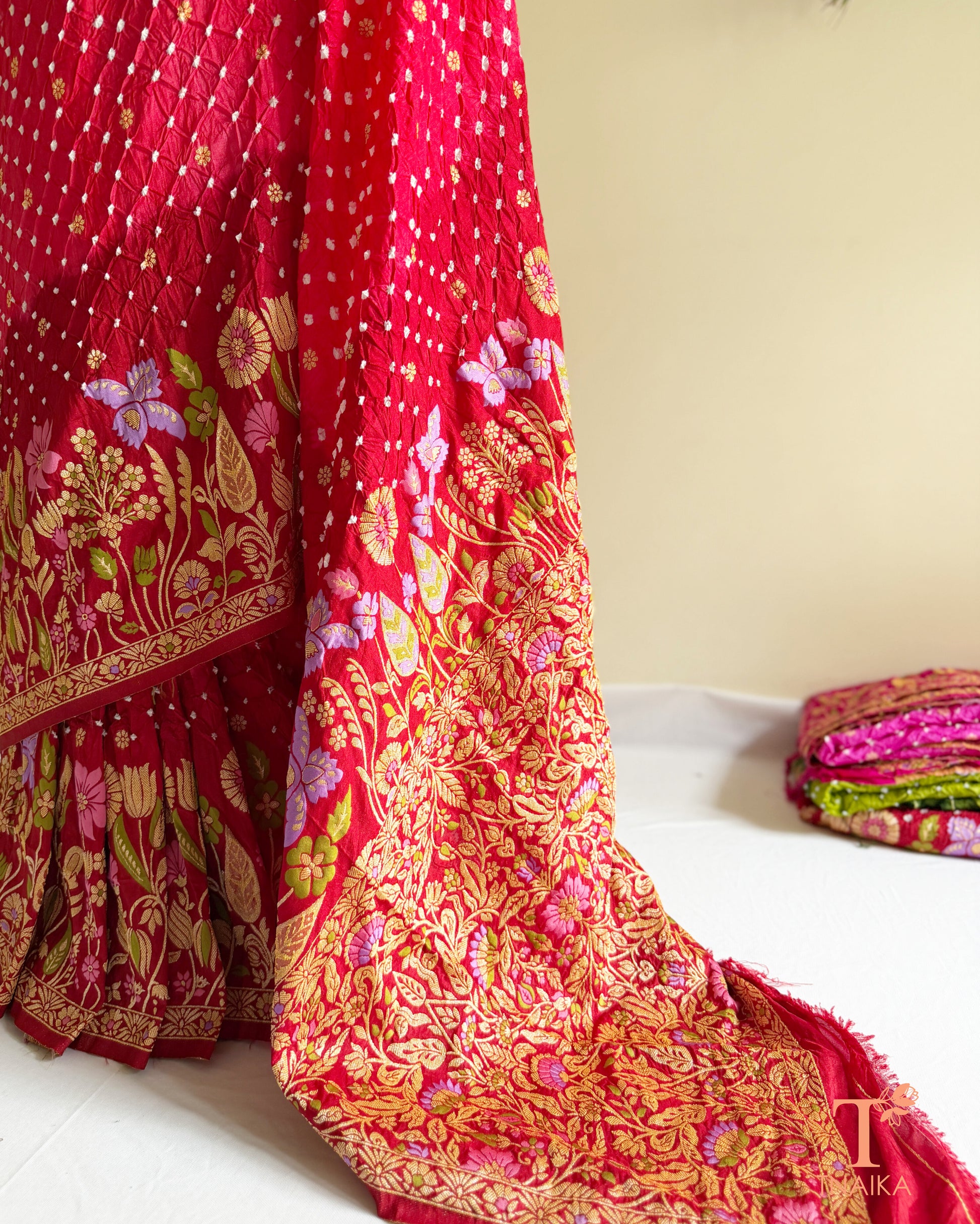 Designer Meenakari woven silk saree with ornate floral craftsmanship.