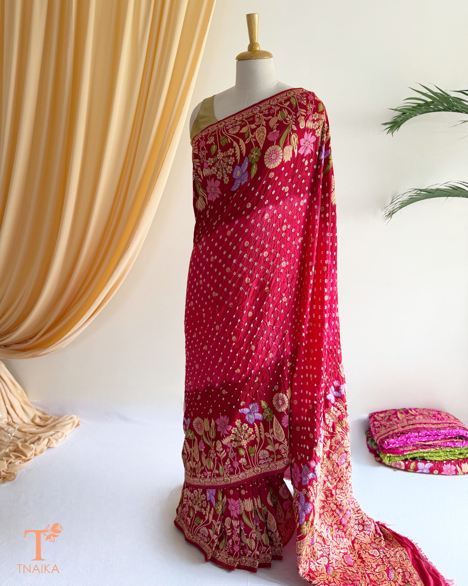 Meenakari Kanjivaram inspired Bandhej Dupion Silk saree with rich woven floral border.