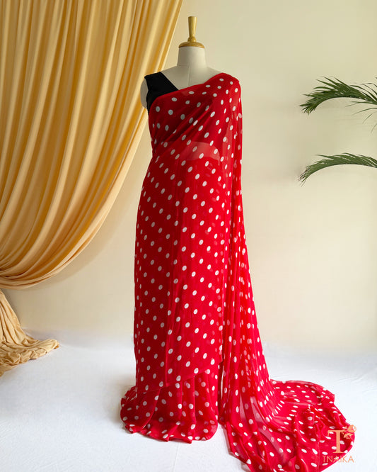 Lightweight georgette saree featuring elegant polka dot prints.