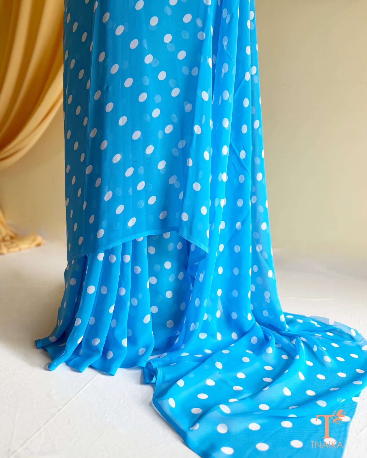 Designer georgette saree with soft fabric and fluid drape.