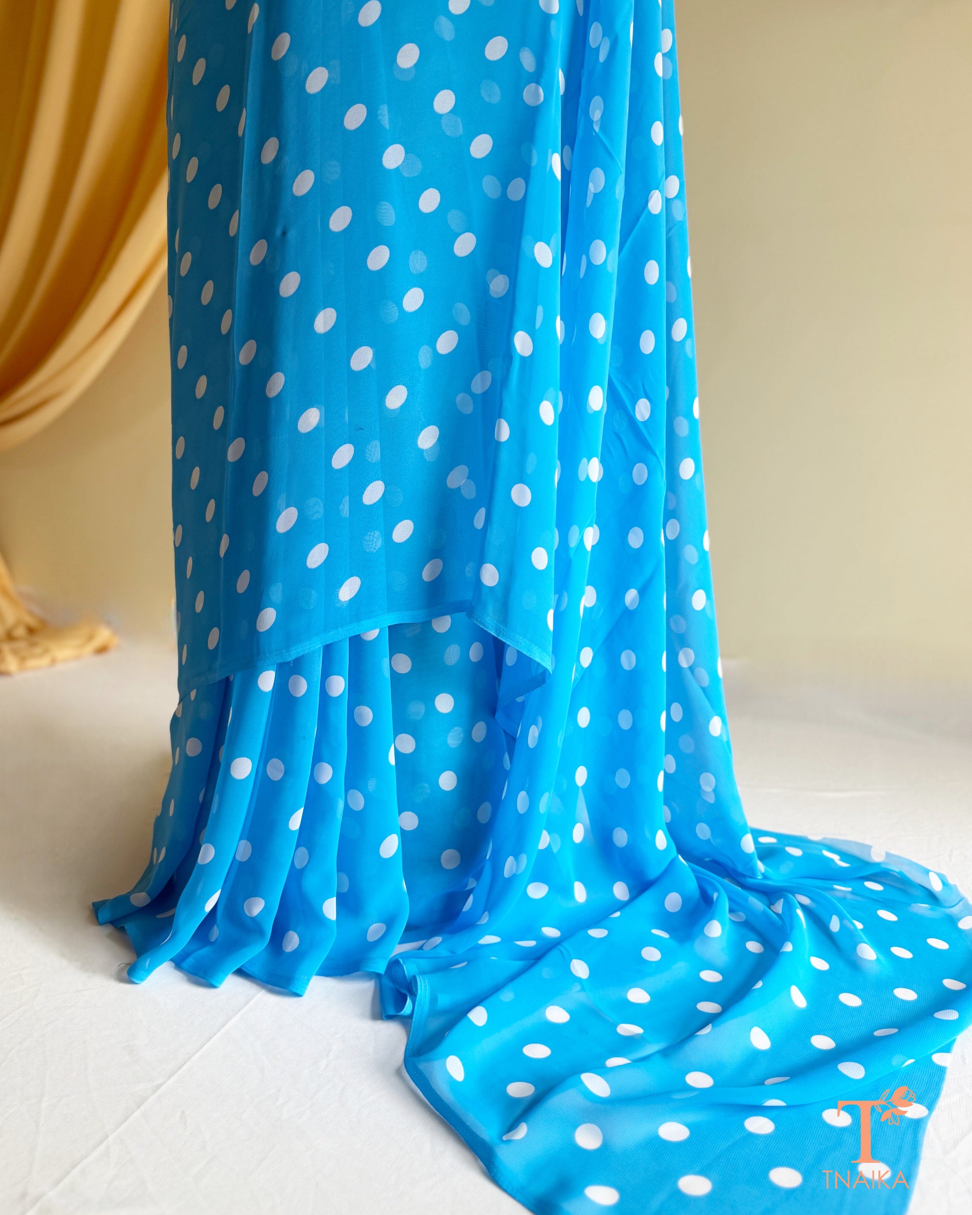 Designer georgette saree with soft fabric and fluid drape.