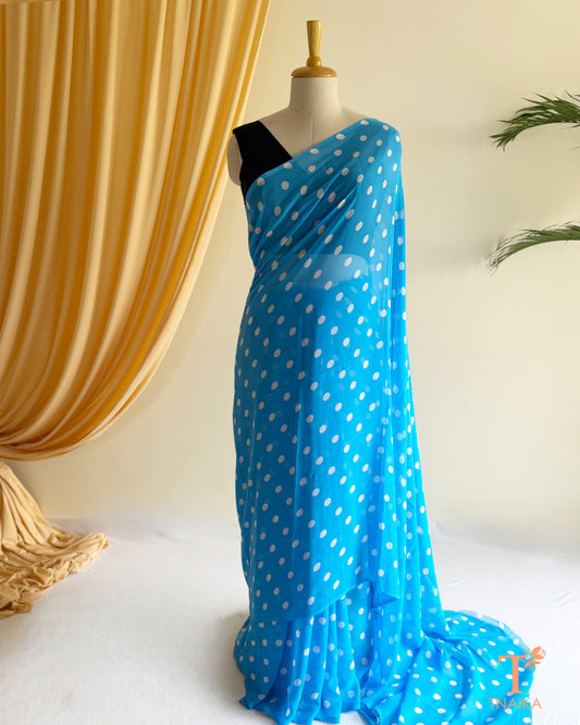 Contemporary georgette saree with stylish dot pattern.
