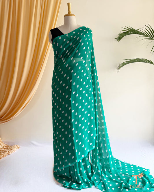 Lightweight georgette saree featuring elegant polka dot prints.