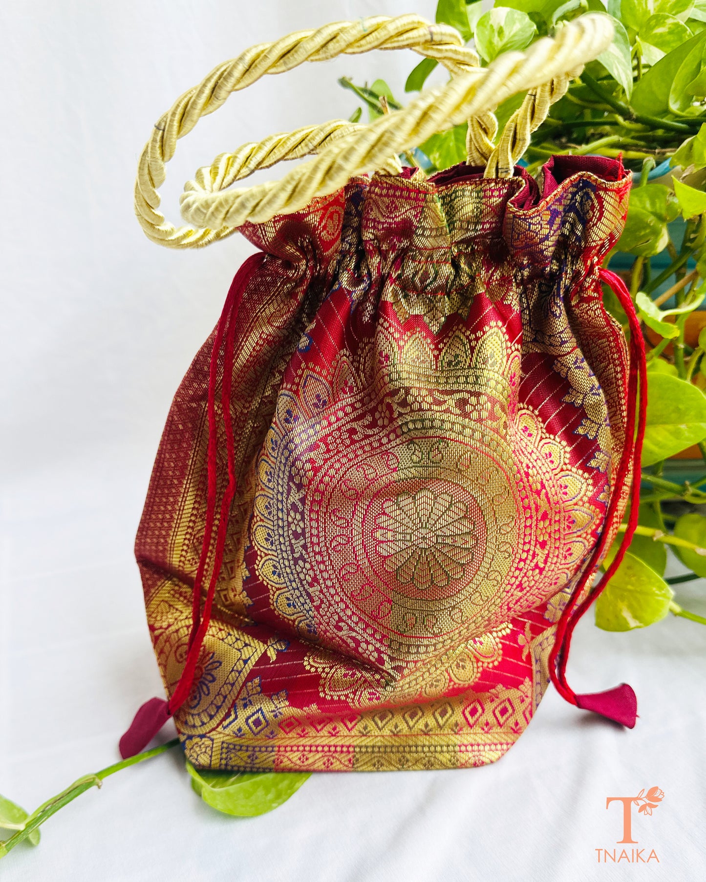 Handcrafted Banarasi brocade 2-in-1 ethnic bag with woven motifs, designed for use as both a spacious tote and an elegant potli.