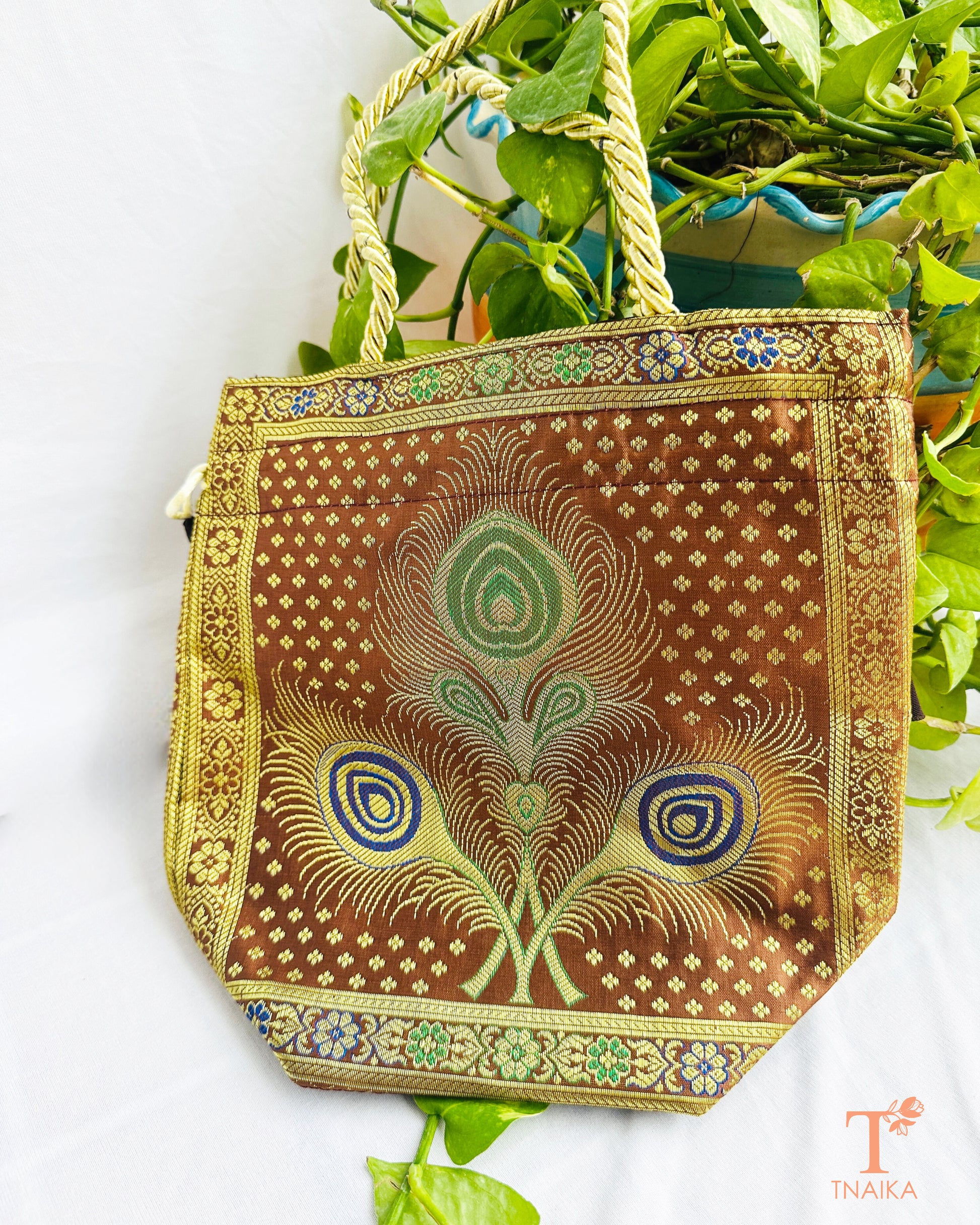 Handcrafted Banarasi brocade 2-in-1 ethnic bag with woven motifs, designed for use as both a spacious tote and an elegant potli.