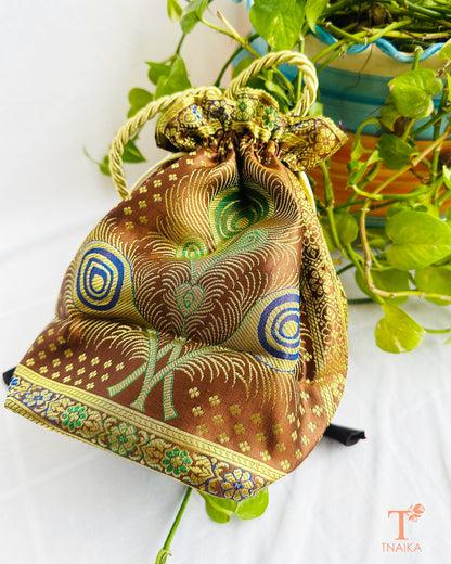 Traditional Banarasi woven fabric convertible handbag featuring dual styling as a tote bag or drawstring potli with rope handles.