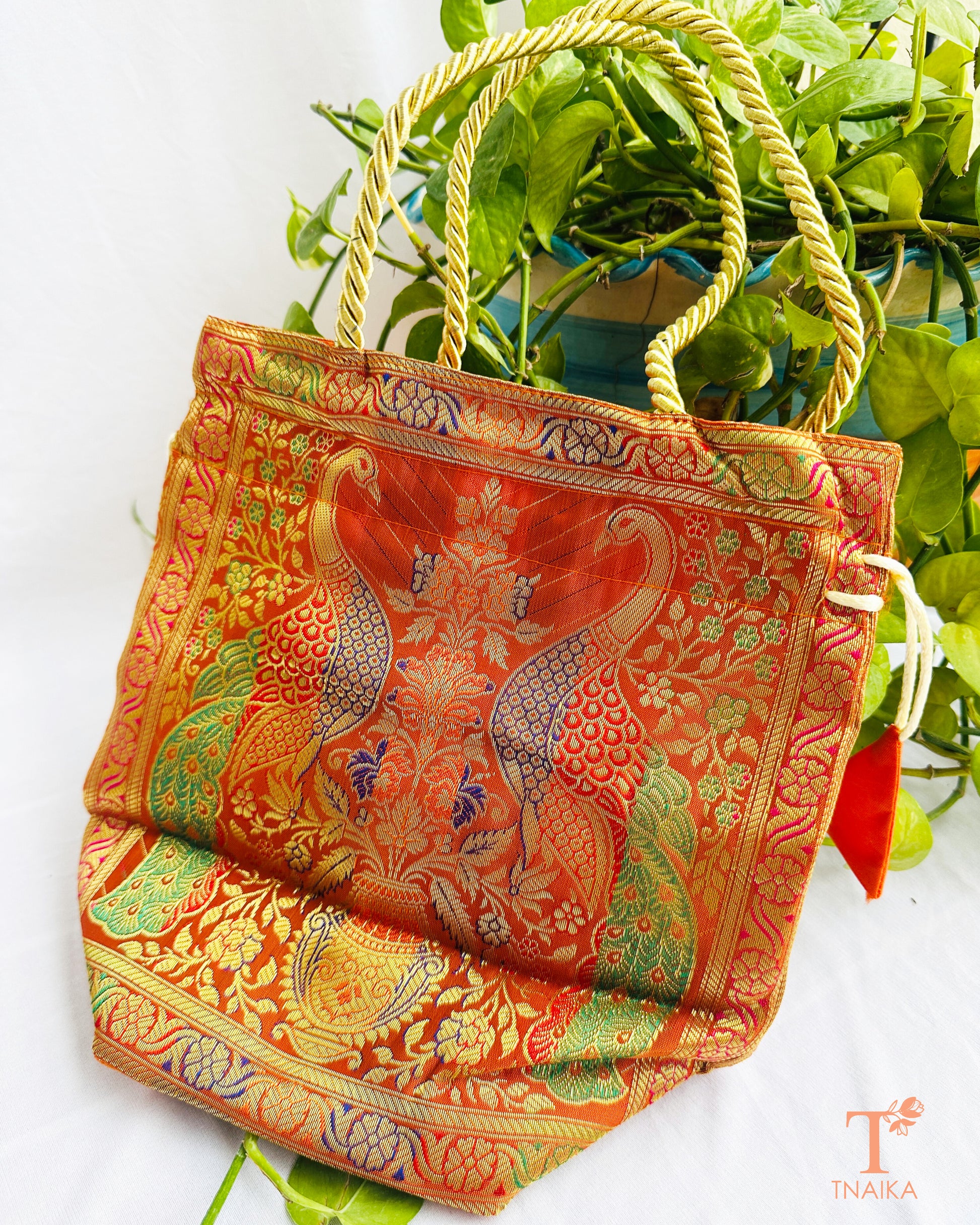 Banarasi 2-in-1 convertible bag that transforms from a tote bag into a traditional drawstring potli for festive and wedding occasions.