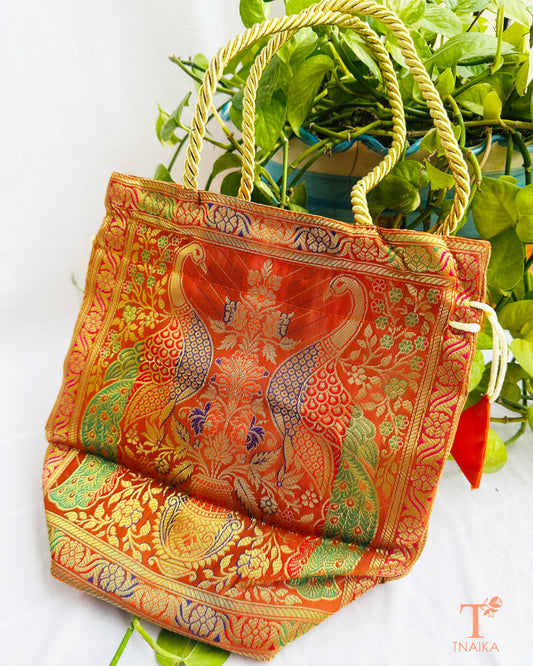 Banarasi 2-in-1 convertible bag that transforms from a tote bag into a traditional drawstring potli for festive and wedding occasions.