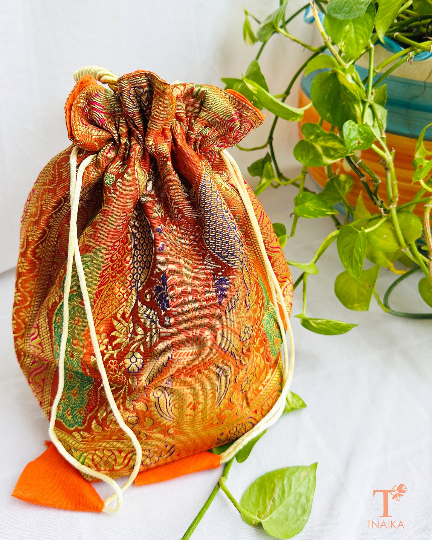 Handcrafted Banarasi brocade 2-in-1 ethnic bag with woven motifs, designed for use as both a spacious tote and an elegant potli.