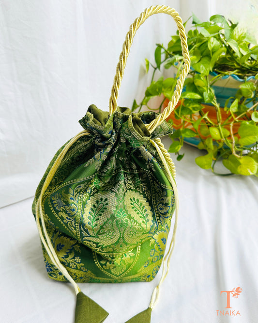 Traditional Banarasi woven fabric convertible handbag featuring dual styling as a tote bag or drawstring potli with rope handles.
