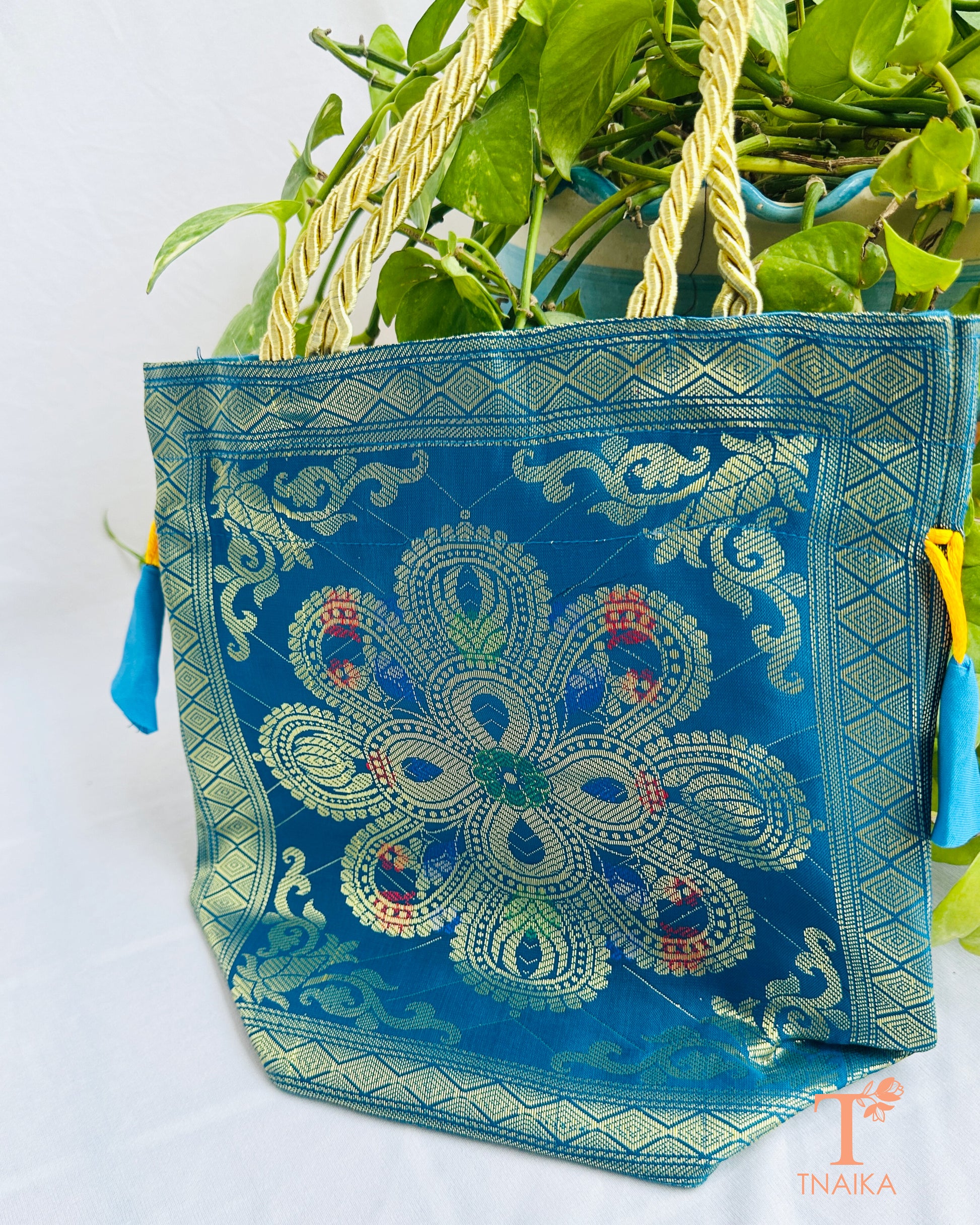 Handcrafted Banarasi brocade 2-in-1 ethnic bag with woven motifs, designed for use as both a spacious tote and an elegant potli.