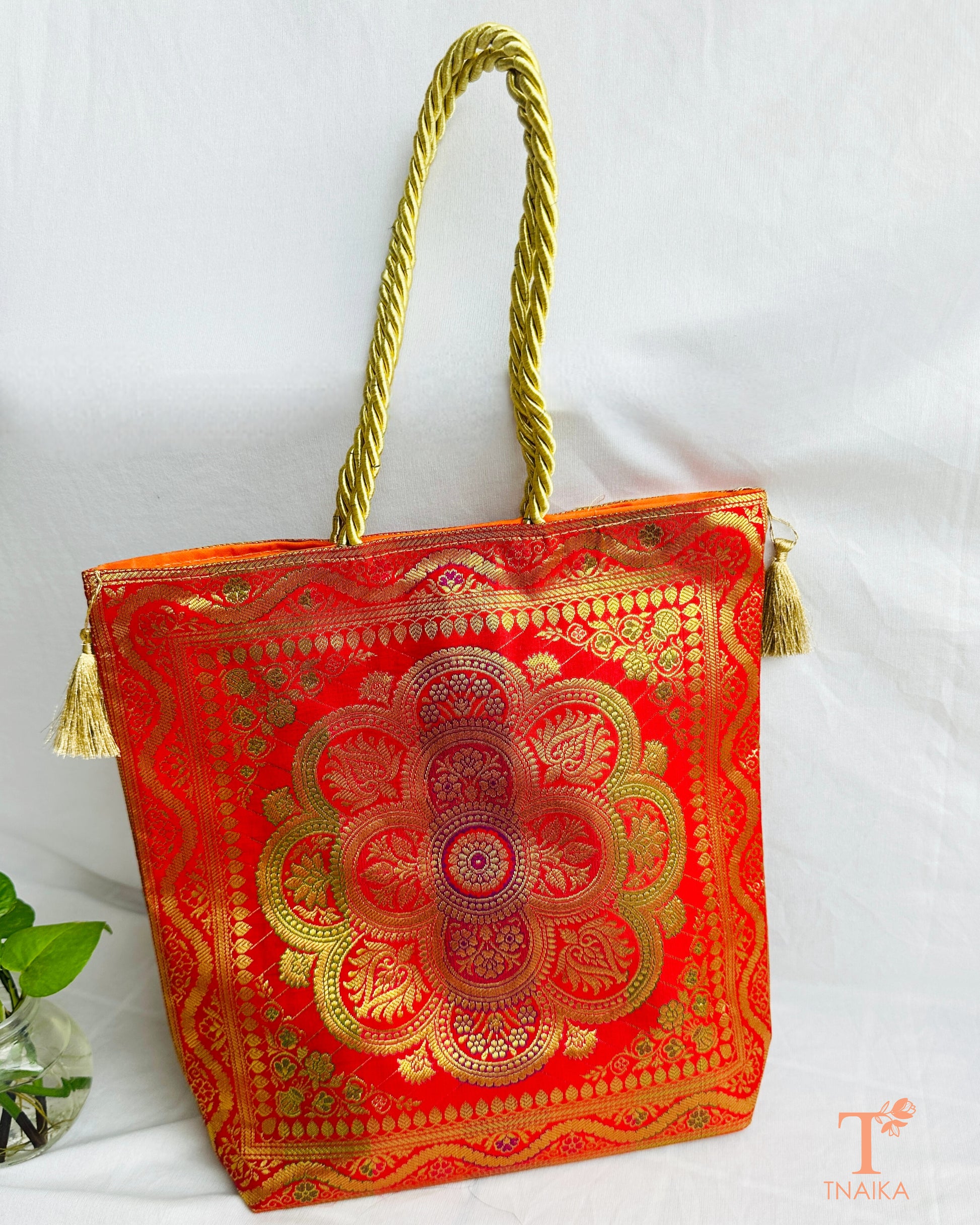 Handcrafted Banarasi bag featuring rich patterns and ethnic detailing