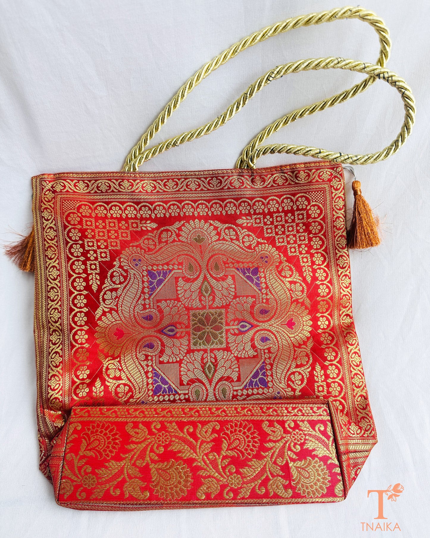 Handcrafted Banarasi bag featuring rich patterns and ethnic detailing