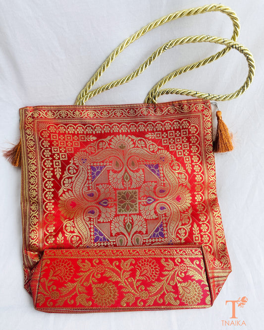 Handcrafted Banarasi bag featuring rich patterns and ethnic detailing