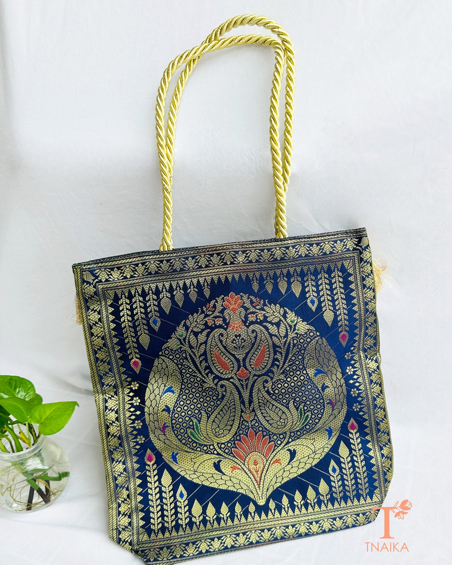 Handcrafted Banarasi bag featuring rich patterns and ethnic detailing
