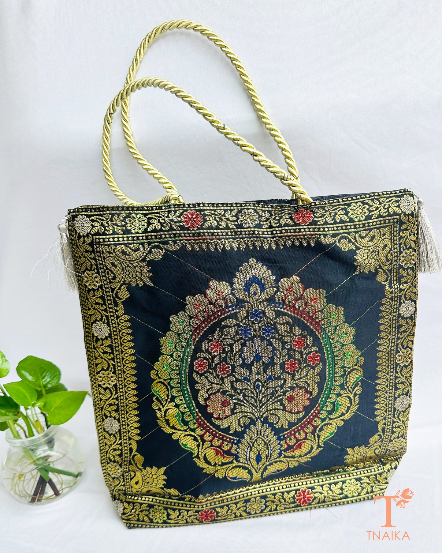 Handcrafted Banarasi bag featuring rich patterns and ethnic detailing