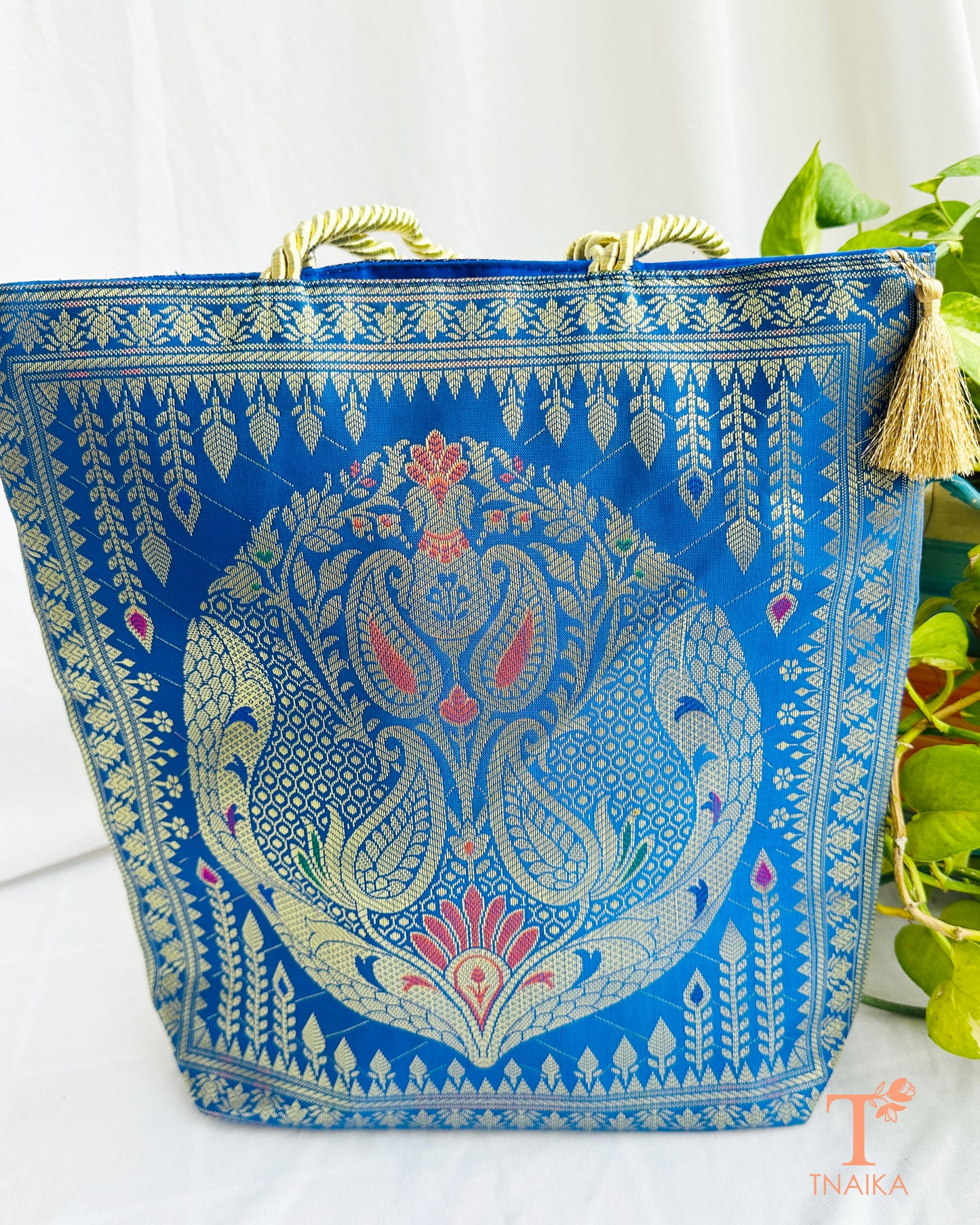 Handcrafted Banarasi bag featuring rich patterns and ethnic detailing