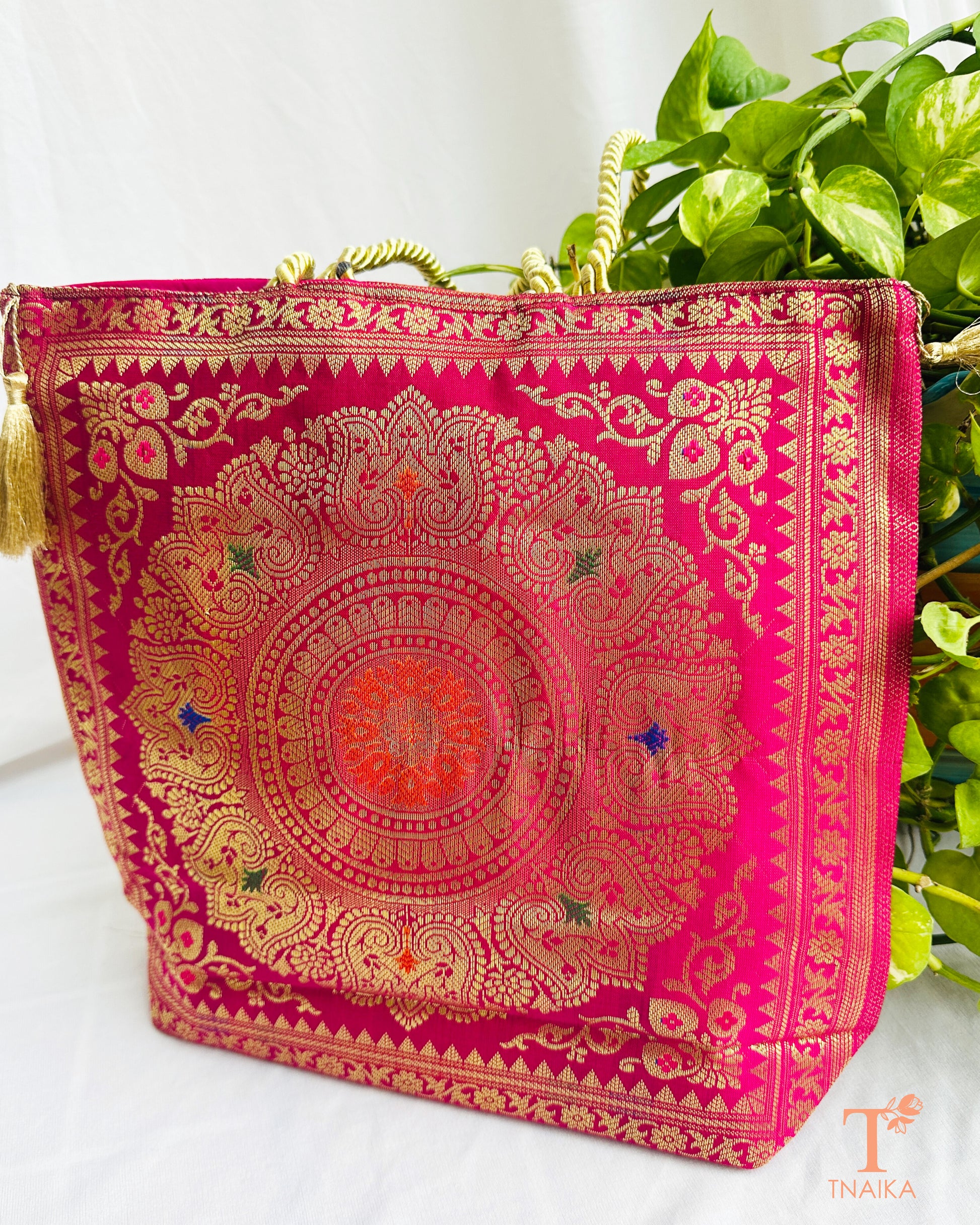 Handcrafted Banarasi bag featuring rich patterns and ethnic detailing
