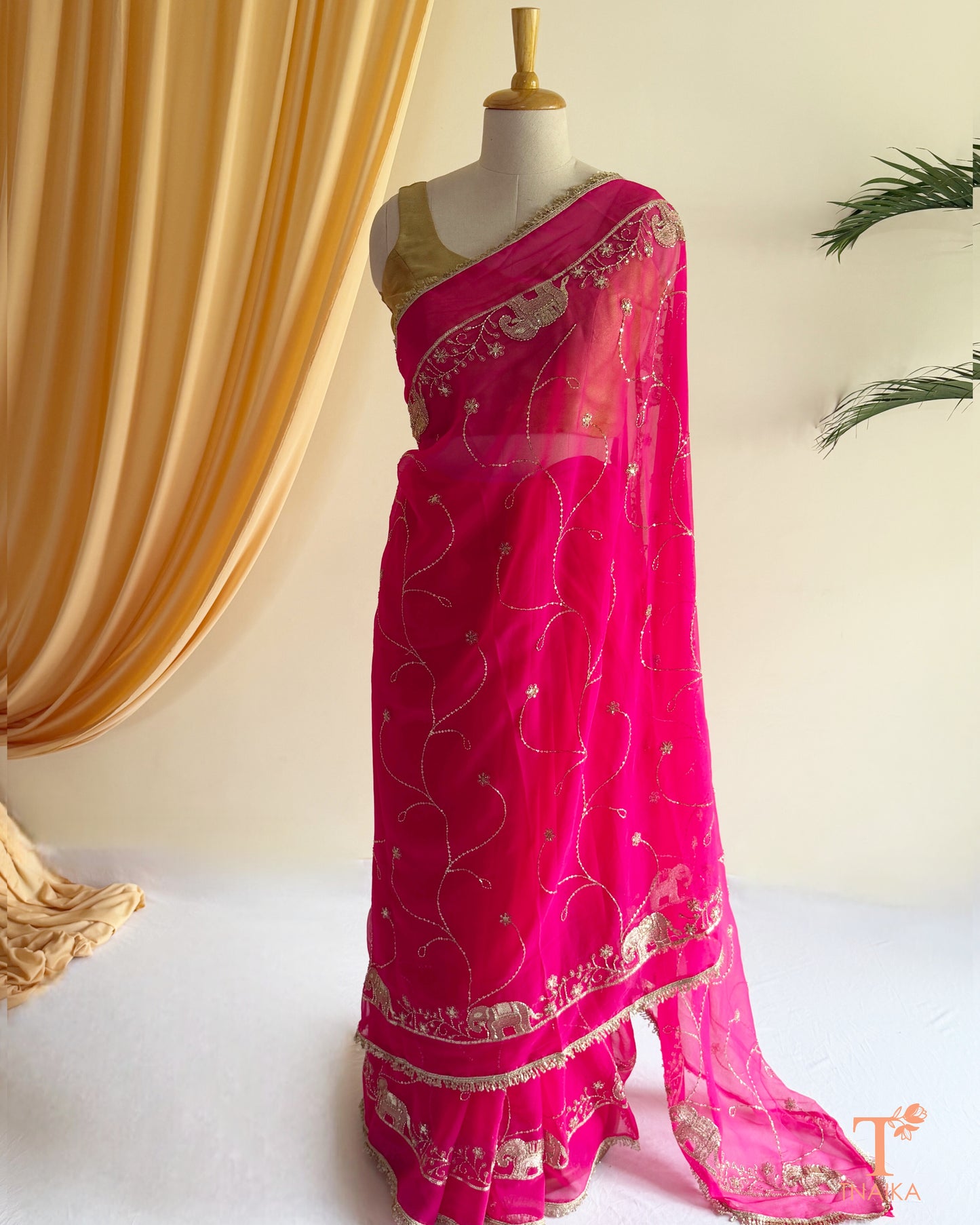 Rajputi style georgette saree with fine cut dana embroidery and elephant motif border