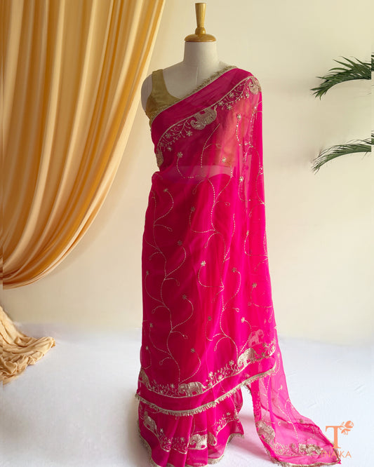 Rajputi style georgette saree with fine cut dana embroidery and elephant motif border