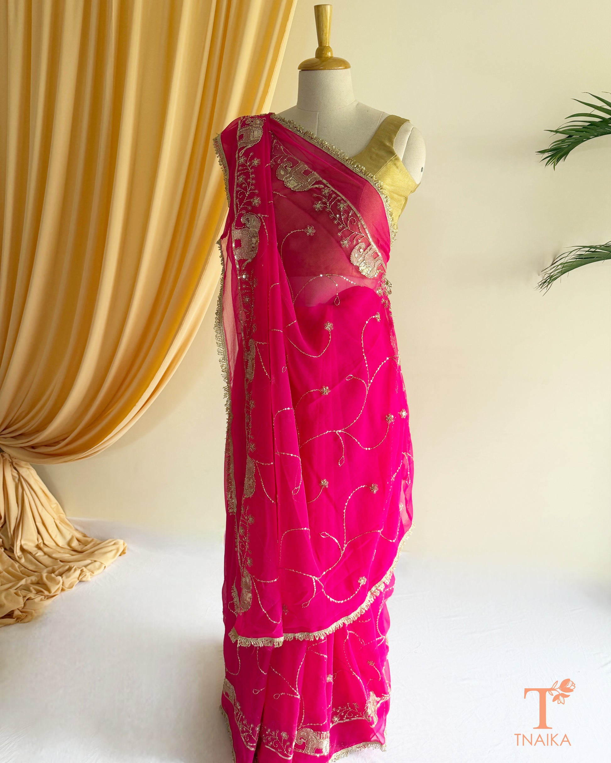 Soft georgette saree featuring elephant motifs and decorative lace border