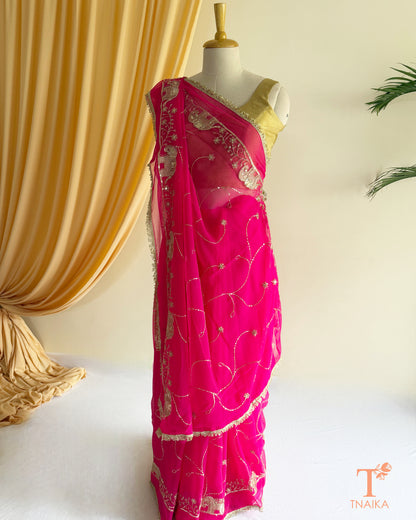 Soft georgette saree featuring elephant motifs and decorative lace border