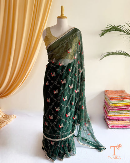 Lightweight georgette saree featuring embroidered elephant border and lace detailing