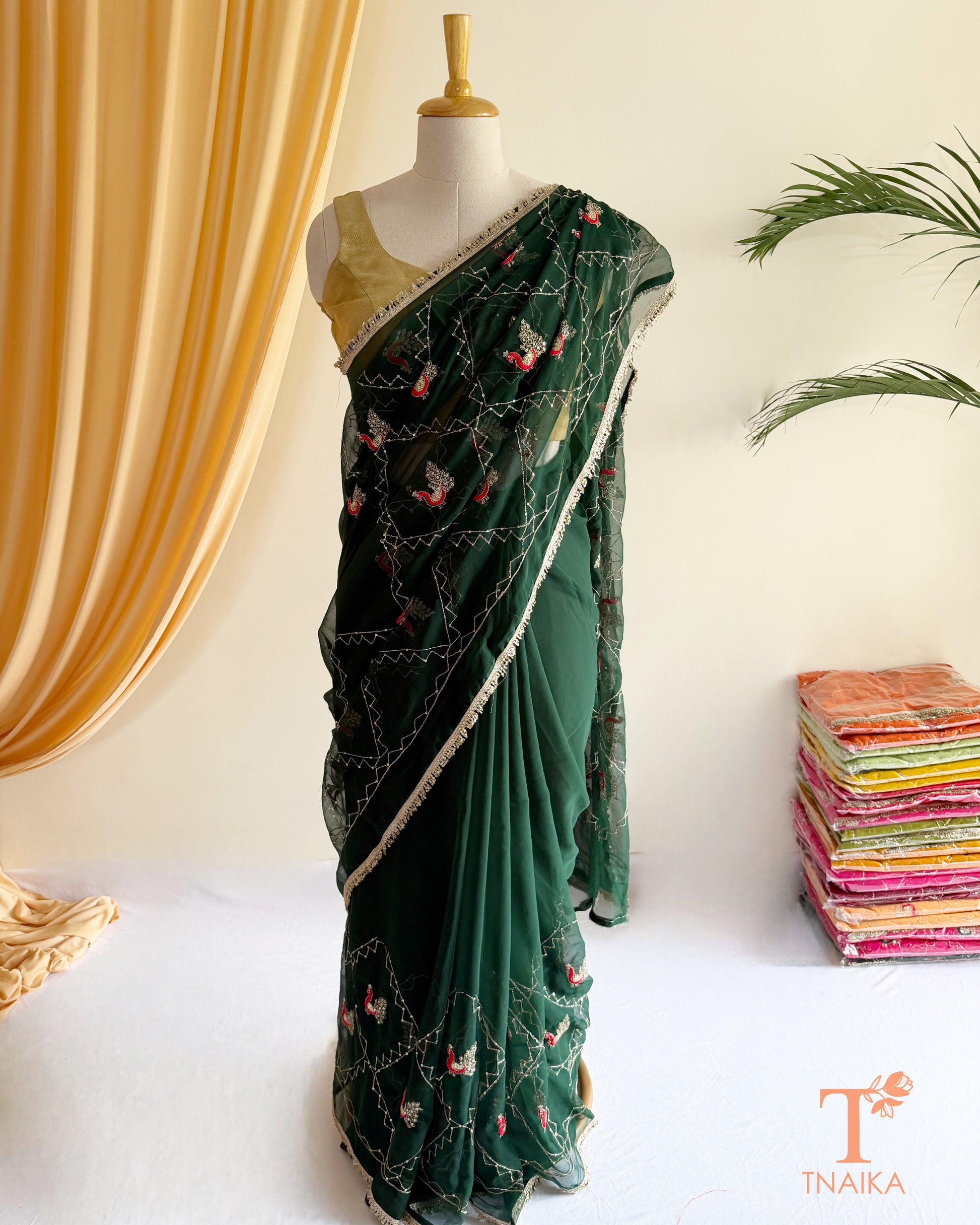 Soft georgette saree featuring elephant motifs and decorative lace border