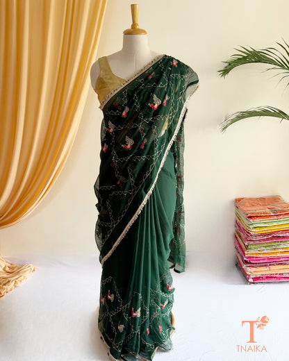 Soft georgette saree featuring elephant motifs and decorative lace border