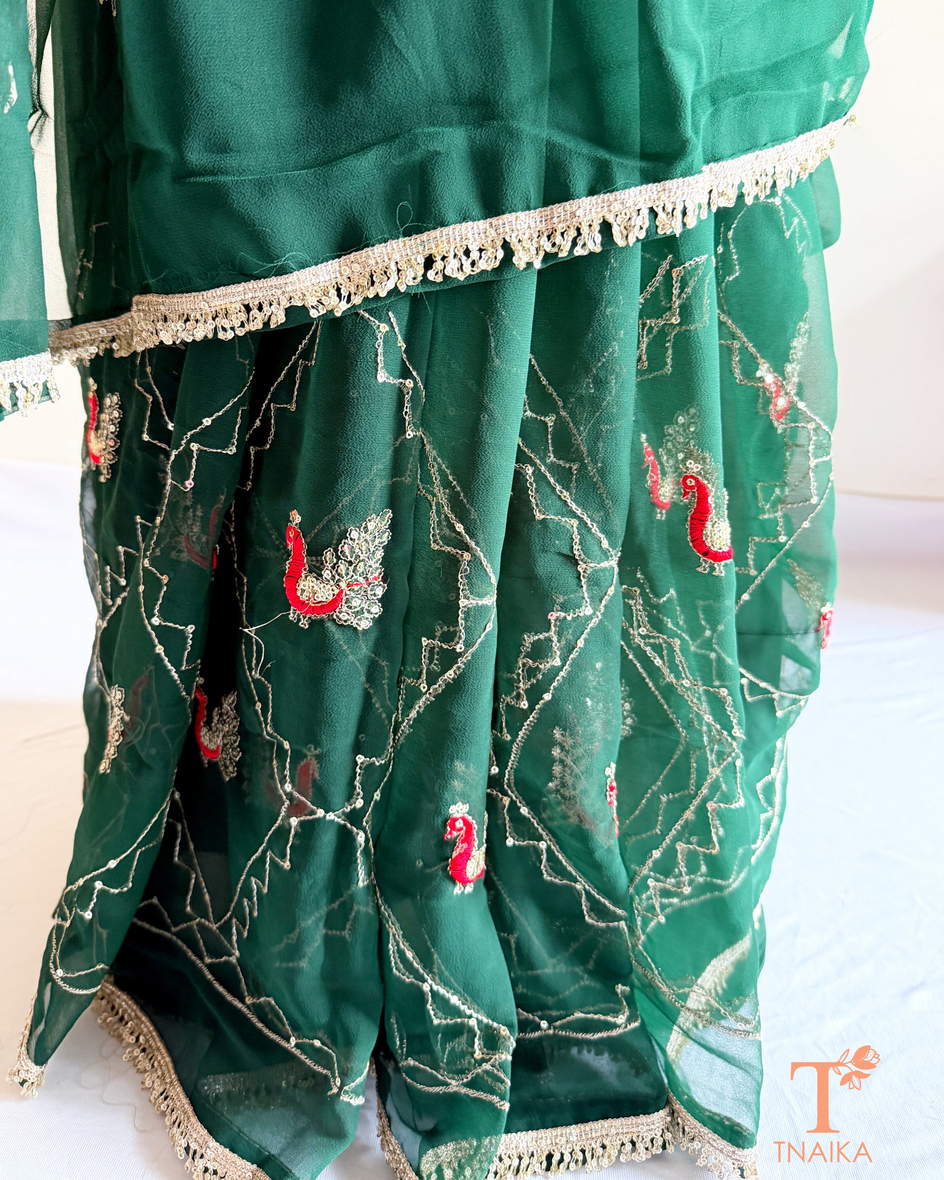 Rajputi style georgette saree with fine cut dana embroidery and elephant motif border