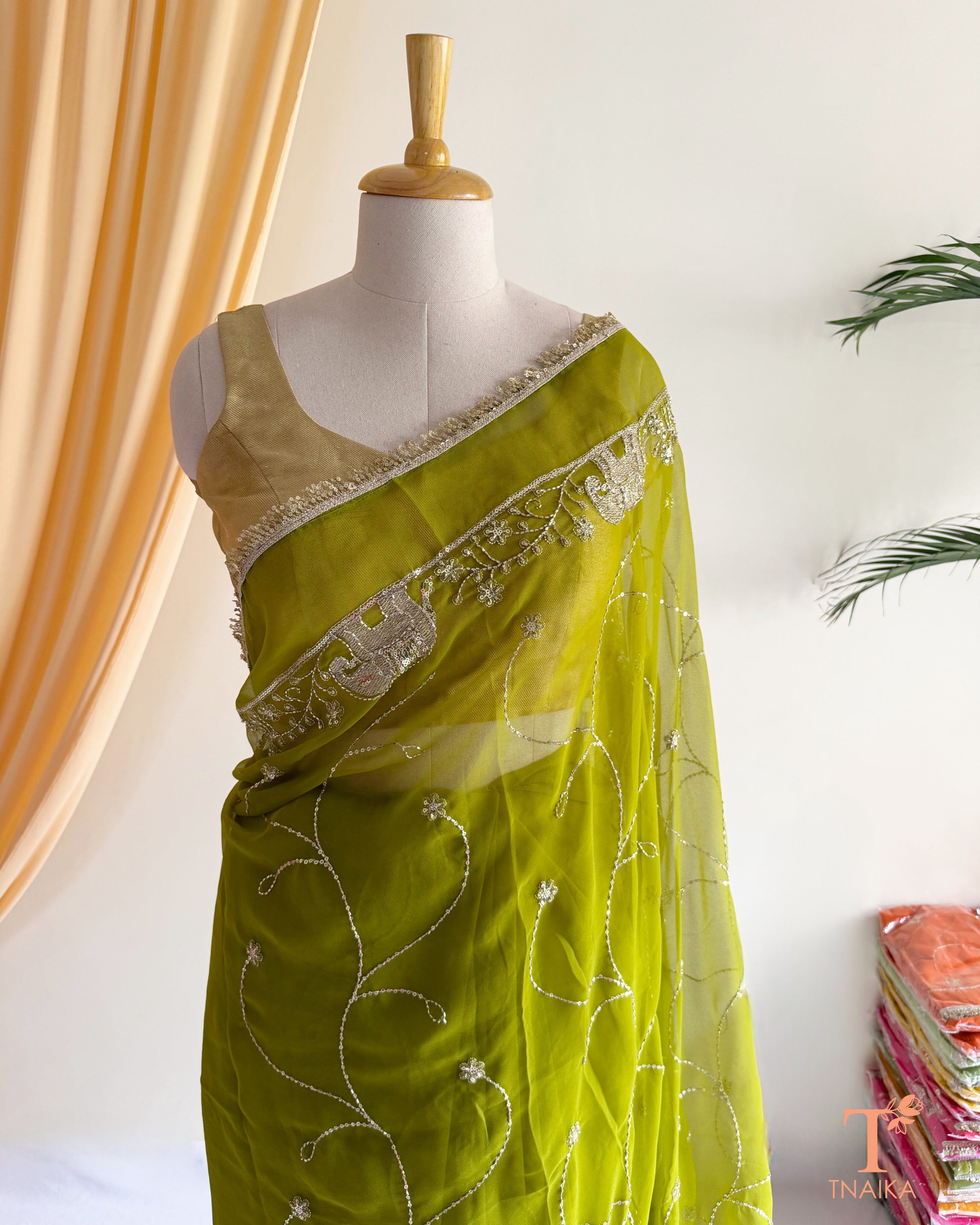Rajputi style georgette saree with fine cut dana embroidery and elephant motif border