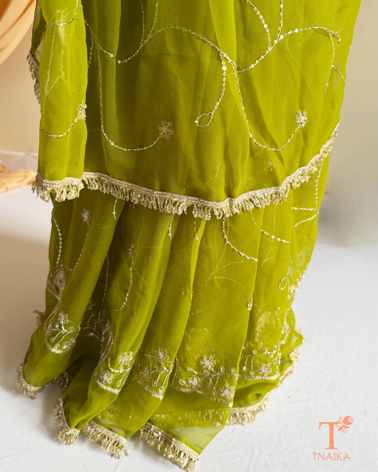 Festive georgette saree with heritage inspired embroidery and flowing drape