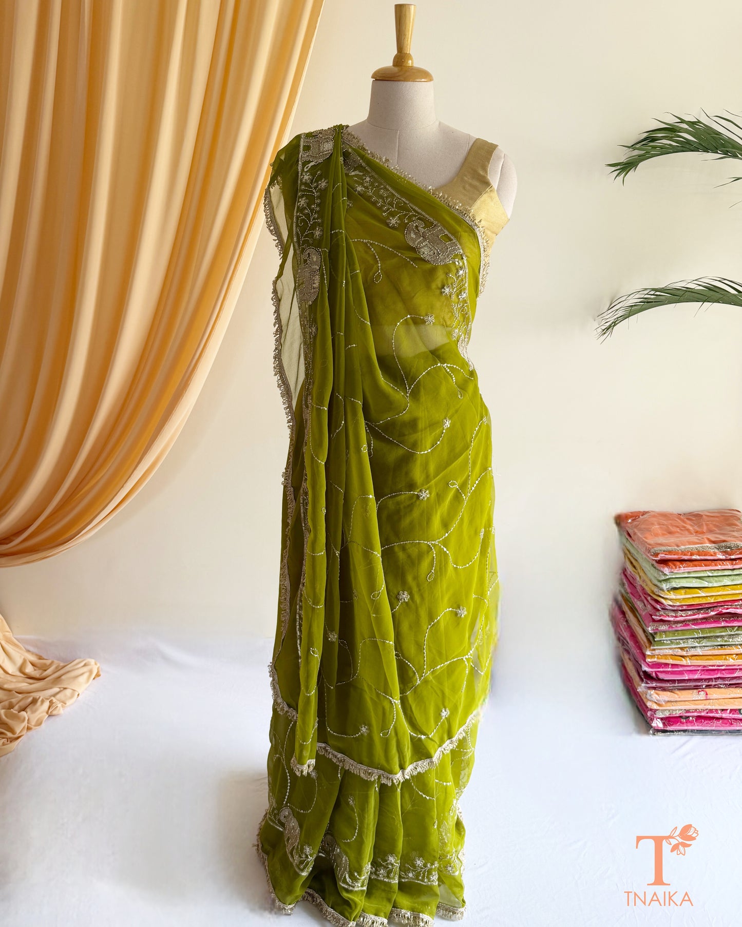 Soft georgette saree featuring elephant motifs and decorative lace border