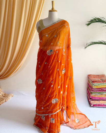 Elegant georgette saree featuring embroidered vine patterns