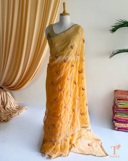 Lightweight georgette saree featuring embroidered elephant border and lace detailing