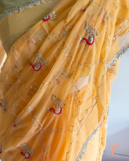 Rajputi style georgette saree with fine cut dana embroidery and elephant motif border