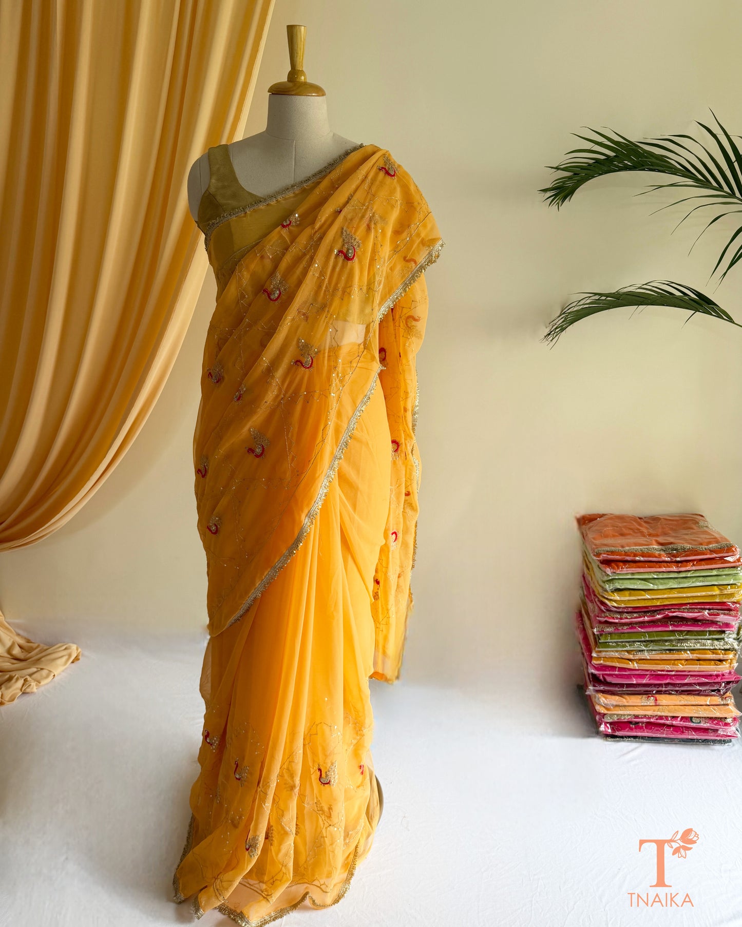 Designer georgette saree with intricate cut dana embroidery and elegant border