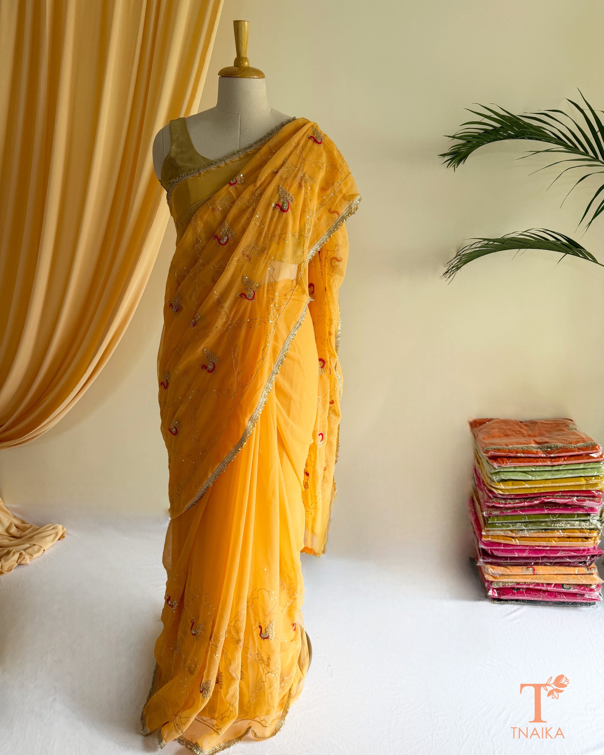 Designer georgette saree with intricate cut dana embroidery and elegant border