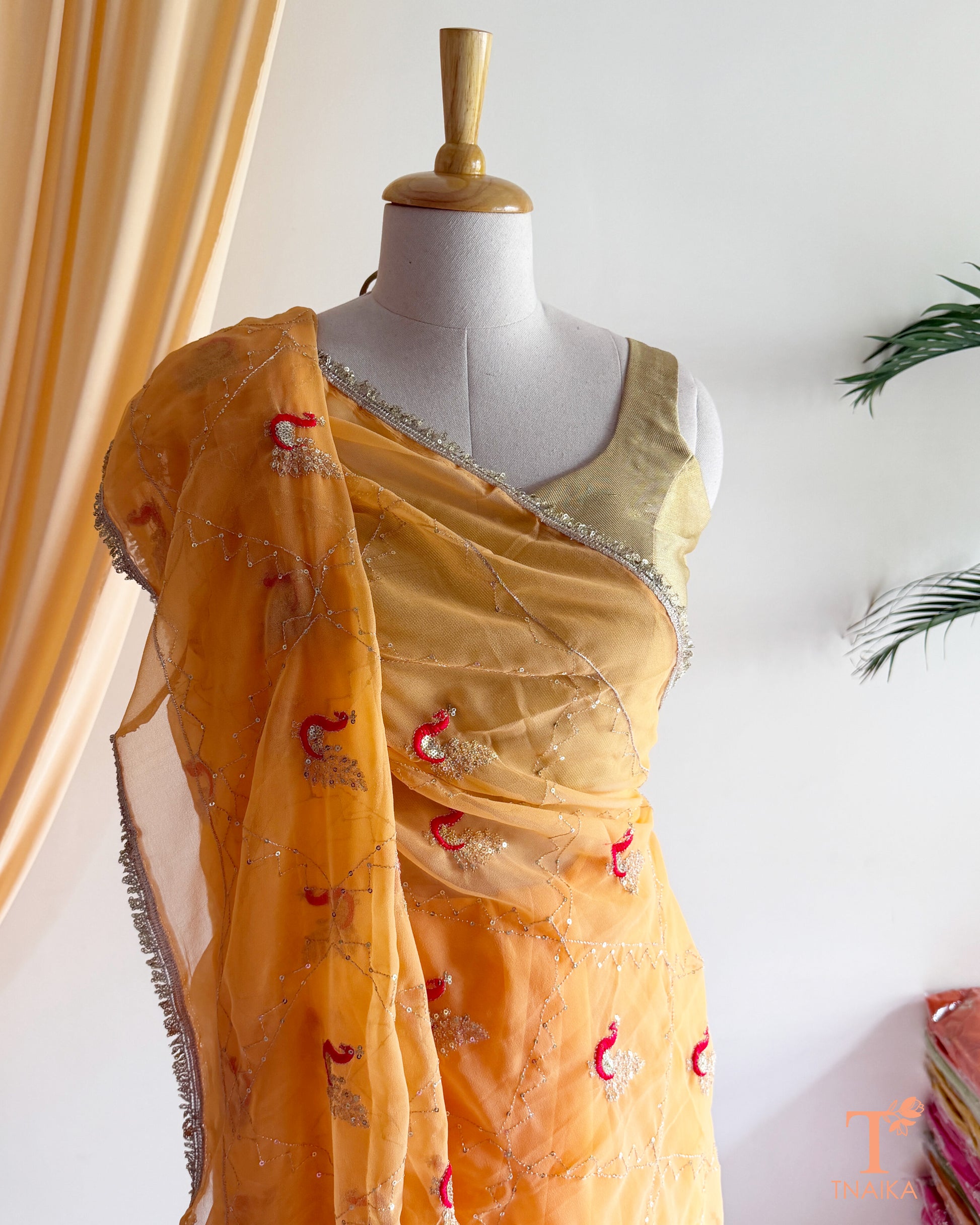 Soft georgette saree featuring elephant motifs and decorative lace border
